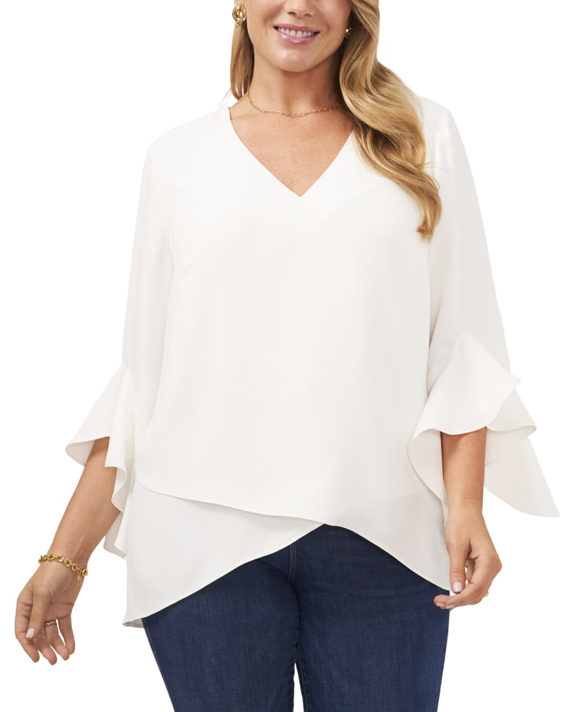 Front of a model wearing a size 1X Natalie Flutter Sleeve Tunic in New Ivory by Vince Camuto. | dia_product_style_image_id:274295